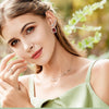 Boucles d'oreilles Argent or rose pierre grenat  sur un visage de femme cheveux long chatain clair