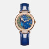    Montre femme acier inoxydable et doré boitier rond représente la tête d'un paon magnifique bracelet acier doré et cuir bleu de france