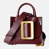 Sac à main de femme en cuir rouge bodeaux bandoulière à grande boucle doré